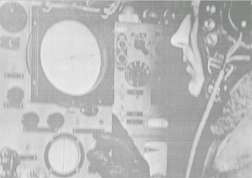 An RAF navigator aboard a bomber monitoring a PPI Display